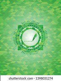 writer icon inside green emblem with triangle mosaic background