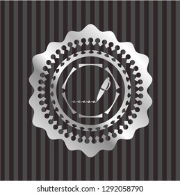 writer icon inside silvery emblem