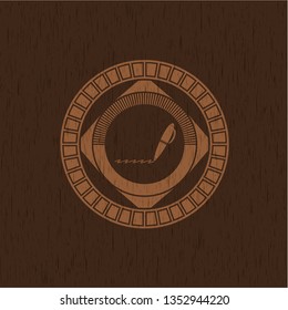 writer icon inside vintage wooden emblem