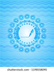 writer icon inside water wave emblem.