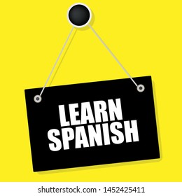 Writing note showing learn spanish. flat sign. sign with white text.