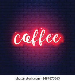 
writing with red neon and brick bacground
