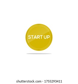 Writing start up in a yellow circle. There is a circular glass in front of the start up article.