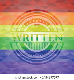 Written on mosaic background with the colors of the LGBT flag