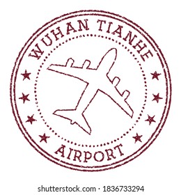 Wuhan Tianhe Airport stamp with a round logo and airplane icon in vector style.