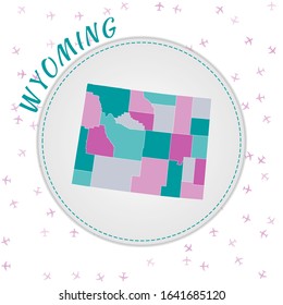 Wyoming map design. Map of the US state with regions in emerald-amethyst color palette. Rounded travel to Wyoming poster with US state name and airplanes background. Captivating vector illustration.