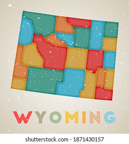 Wyoming map. US state poster with colored regions. Old grunge texture. Vector illustration of Wyoming with the state name.