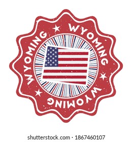 Wyoming round grunge stamp with us state map and country flag. Vintage badge with circular text and stars, vector illustration.