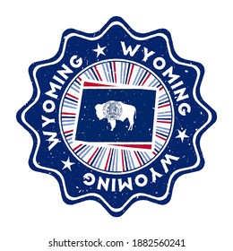 Wyoming round grunge stamp with US state map and state flag. Vintage badge with circular text and stars, vector illustration.