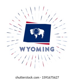 Wyoming sunburst badge. The US state sign with map of Wyoming and state flag. Colorful rays around the logo. Vector illustration.