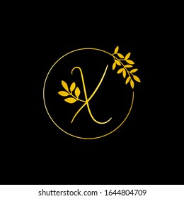 X Gold letter and Gold Leaf logo design. X Letter golden initial luxury Boutique Nature Floral Flower. X Monogram vector design concept and with leaf for fashion brand and luxuries business identity.