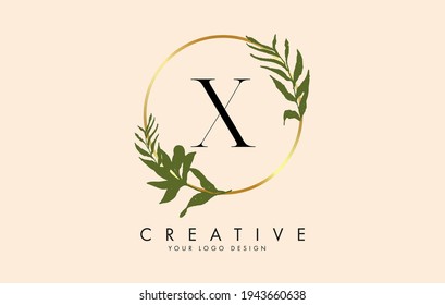X Letter logo design with golden circles and green leaves on branches around it. Vector Illustration with X letter for personal branding, corporate, business, eco friendly or natural products. 