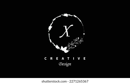 X letter logo in white water color on black background Vector abstract design element.