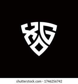 XG monogram logo with modern shield style design template isolated on black background