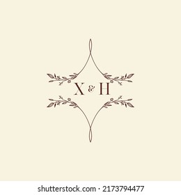 Cartas iniciales del logotipo de la boda XH en un diseño profesional de alta calidad que se imprimirán en cualquier medio impreso
