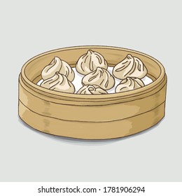 Xiao long bao or steamed dumplings in wooden container