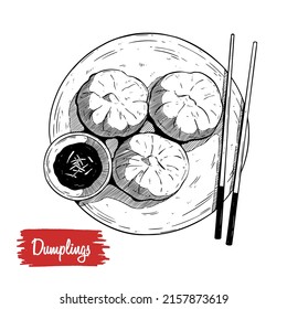 Xiao long bao, steamed dumplings bun with sauce. A plate of dumplings and chopsticks