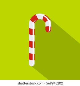 Xmas candy cane icon. Flat illustration of xmas candy cane vector icon for web on lime background