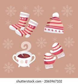 xmas clothes, socks, tea, gloves, and beanie in red and white color on beige snowflakes background