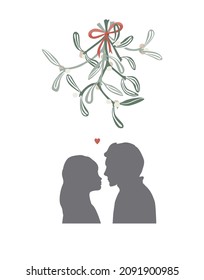 Xmas kissing under mistletoe branch. The guy and the girl are going to kiss. A gentle first kiss. Relations, love, date, love, passion, teens love concept.