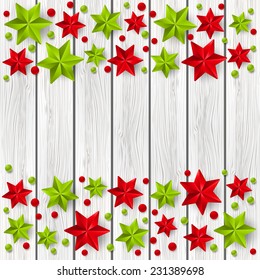 Xmas starry decorations on white wooden background