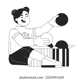Xmas sweater girl unpacking box with baubles black and white 2D line character. Asian female child sitting with Christmas ornaments isolated vector outline person. Monochromatic spot illustration