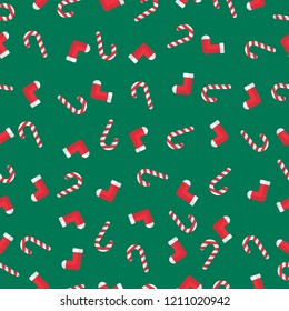 X'mas things seamless pattern gift wrap paper. Candy cane, sock. Green rectangle background. Flat style. 