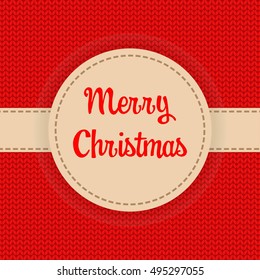 Xmas winter background with knitted stitches and fabric banner Merry Christmas 
