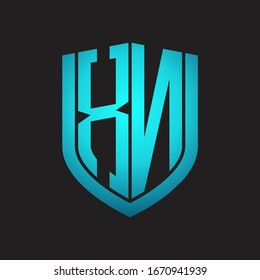 XN Logo monogram with emblem shield design isolated with blue colors on black background