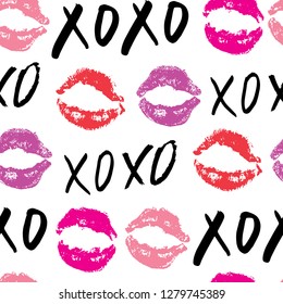 XOXO brush lettering signs seamless pattern, Grunge calligraphic hugs and kisses Phrase, Internet slang abbreviation XOXO symbols, vector illustration isolated on white background