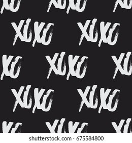 Xoxo brush stroke seamless vector pattern. Hand drawn symbol of hugs and kisses. Romantic Valentine's Day texture. Repeated decorative background for print, textile, greetings, wrapping, or web use.