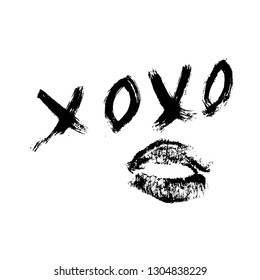 XOXO hand written phrase and lipstick kiss isolated on white background. Hugs and kisses sign. Grunge brush lettering XO. Easy to edit template for Valentine’s day greeting card, banner, poster. 