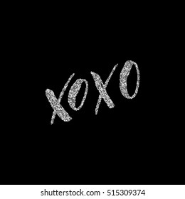 XOxo - ink freehand lettering with silver glitter texture. Modern brush calligraphy, isolated on the black background.