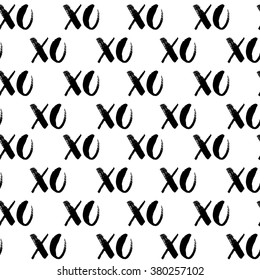 XOXO vector seamless pattern. Hugs and kisses. Hand drawn monochrome texture. 