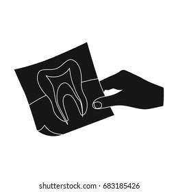 X-ray of the tooth in the hand of the dentist. Stomatology single icon in black style vector symbol stock illustration web.