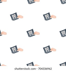 X-ray of the tooth in the hand of the dentist. Stomatology single icon in cartoon style vector symbol stock illustration web.