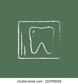 X-ray of the tooth hand drawn in chalk on a blackboard vector white icon isolated on a green background.