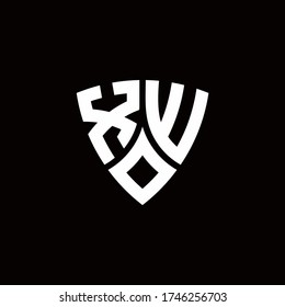 XW monogram logo with modern shield style design template isolated on black background