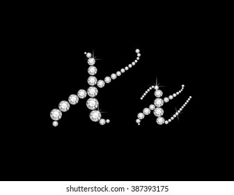 Xx in stunning Diamond Script precious round jewels, isolated on black. Vector EPS-10 file, transparency used. 