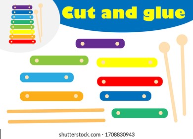 Xylophone in cartoon style, education game for the development of preschool children, use scissors and glue to create the applique, cut parts of the image and glue on the paper, vector illustration