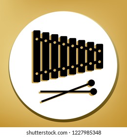 Xylophone sign. Vector. Black icon with light brown shadow in white circle with shaped ring at golden background.