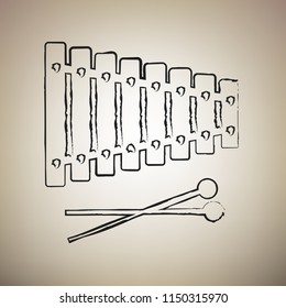 Xylophone sign. Vector. Brush drawed black icon at light brown background.