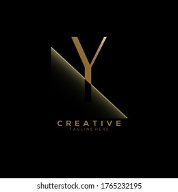 Y Gold Letter Logo Design with Creative Paper Cut