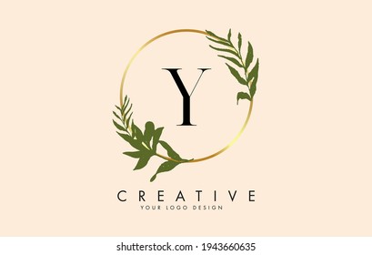 Y Letter logo design with golden circles and green leaves on branches around it. Vector Illustration with Y letter for personal branding, corporate, business, eco friendly or natural products. 