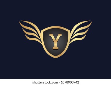 Y Letter logo with golden winged shield , vector illustration