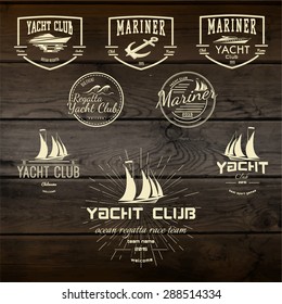 Yacht club badges logos and labels for any use. On wooden background texture