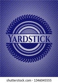 Yardstick emblem with jean background