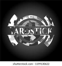 Yardstick on grey camo texture