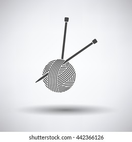 Yarn ball with knitting needles icon on gray background, round shadow. Vector illustration.