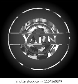 Yarn on grey camo texture